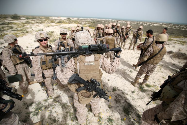 U.S. Navy Marines and Saudi Navy Special Force personnel gather during mixed maritime exercise with U.S. Navy and Saudi Royal Navy, at Saudi Military Port, Ras Al Ghar, Eastern Province, in Jubail