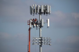 Workers install a new cell phone tower, amid the coronavirus disease (COVID-19) outbreak, in San Marcos