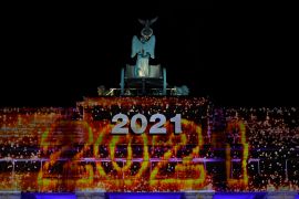 Berlin's landmark Brandenburg Gate is illuminated with the lettering "2021"' at the start of a concert 'Willkommen 2021' (Welcome 2021) in Berlin