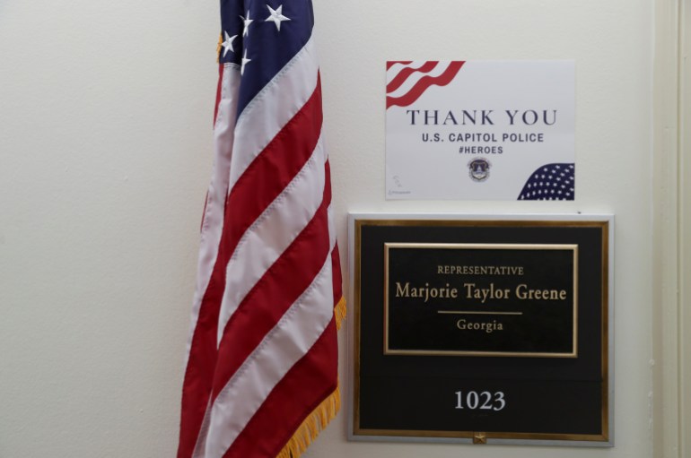 The name plate outside of U.S. Rep. Marjorie Taylor Greene's office with a sign thanking Capitol Police taped above it is seen, in Washington