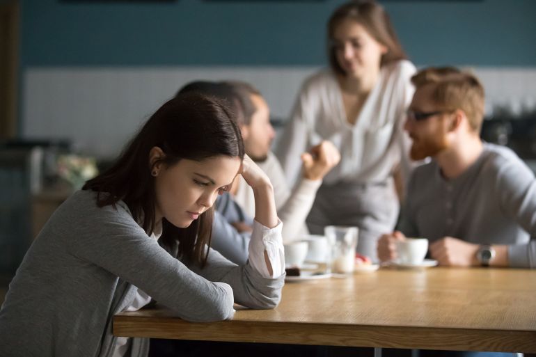 Upset young girl sit alone at coffee table in café feeling lonely or offended, sad female loner avoid talking to people, student outsider suffer from discrimination, lacking friends or company; Shutterstock ID 1194497182; Department: -