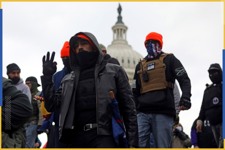 Supporters of U.S. President Donald Trump make the 'OK' hand gestures indicating "white power", during a protest against the certification of the 2020 presidential election results by the Congress, at the Capitol in Washington, U.S., January 6, 2021. Picture taken January 6, 2021. REUTERS/Jim Urquhart