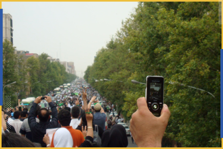 EDITORS' NOTE: Reuters and other foreign media are subject to Iranian restrictions on their ability to report, film or take pictures in Tehran. A man uses a mobile phone to record images of a protest in Tehran in this undated photo made available June 22, 2009. REUTERS via Your View (IRAN POLITICS ELECTIONS)