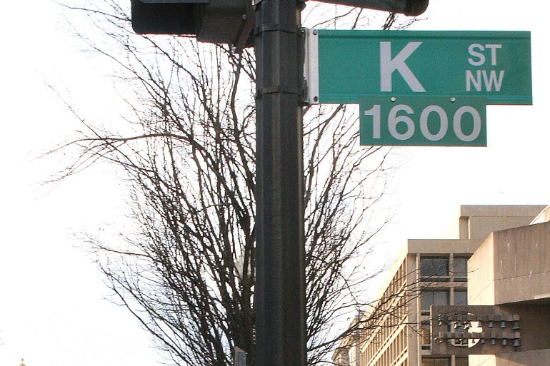 A sign showing K Street is shown 01 February 2006 in Washington,DC. A stone's throw from the White House, K Street is an alternative corridor of power in US politics, packed with thick carpeted offices and lobbyists with even deeper pockets.But the largesse that flowed from Jack Abramoff, an influential member of the K Street lobbying army, threatens now to rebound against the whole sector. Both opposition Democrats, and President George W. Bush's majority Republicans, who face the most serious charges from the Abramoff scandal, are making proposals to clamp down on lobbyists.There are an estimated 30,000 lobbyists working in Washington, mainly lawyers, working for groups ranging from big business contract hunters to turkey hunters who feel their pastime is under threat.For example, Akin, Gump, Strauss, Hauer and and Felt, a Texan firm, has about 100 lawyers in Washington who represent some 200 pressure groups and associations, making sure that lawmakers are aware of their concerns. AFP PHOTO/KAREN BLEIER (Photo by KAREN BLEIER / AFP)