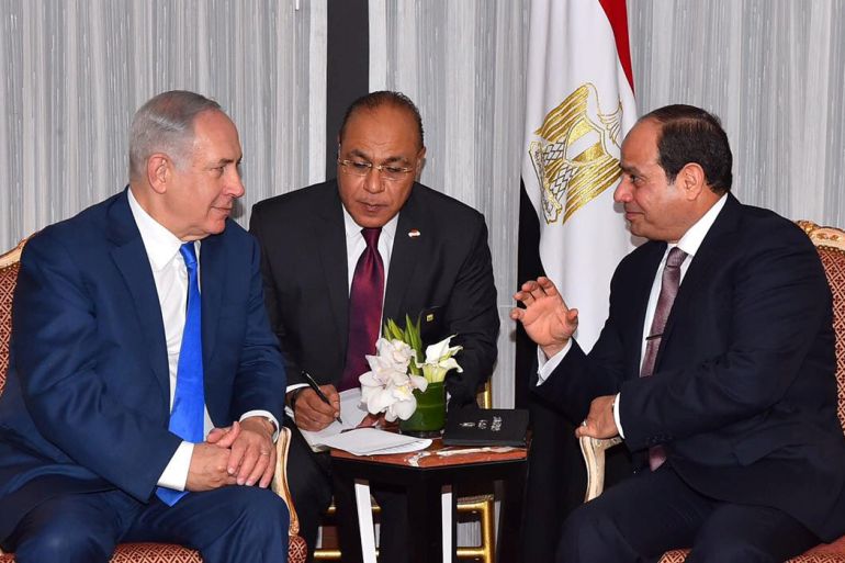 Egyptian President Abdel Fattah al-Sisi speaks with Israeli Prime Minister Benjamin Netanyahu during their meeting as part of an effort to revive the Middle East peace process ahead of the United Nations General Assembly in New York