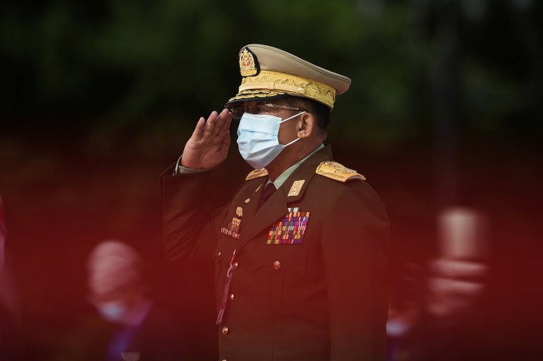 Myanmar's Army Chief Min Aung Hlaing salutes during the Martyrs' Day ceremony in Yangon on July 19, 2020.
