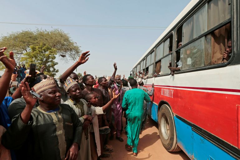 People gather to receive their sons, who have been rescued by the Nigerian security forces in Katsina