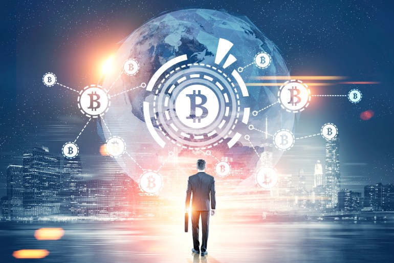 Rear view of a businessman with a suitcase looking at a bitcoin network with a bitcoin sign inside an HUD, world map. Night city. Toned image double exposure Elements of this image furnished by NASA; Shutterstock ID 683158678; Department: -