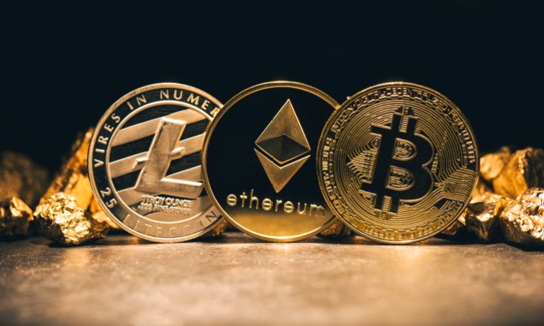 Golden cryptocurrencys Bitcoin, Ethereum, Litecoin and mound of gold - Business concept image; Shutterstock ID 770928178; Department: -