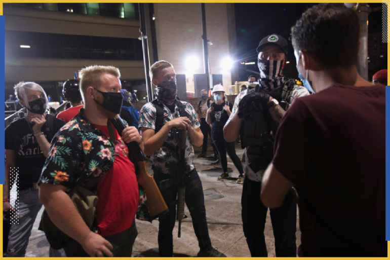 Boogaloo Boys, Tom Jeffy, of Washington, D.C., from left, Duncan Lemp, of Georgetown, Texas, and "Shifty", of Dallas, talk with a local resident who wanted to know why they were at the Black Lives Matter rally in Austin, Texas, U.S., August 1, 2020. The men said they were there to protect the marchers and their free speech rights. Picture taken August 1, 2020. REUTERS/Nuri Vallbona