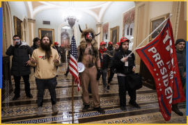 epa08976298 (FILE) - Supporters of US President Donald J. Trump, including 'QAnon Shaman' Jacob Anthony Angeli Chansley (C), stand by the door to the Senate chambers after they breached the US Capitol security in Washington, DC, USA, 06 January 2021 (reissued on 30 January 2021). According to reports on 30 January 2021, Jacob Anthony Angeli Chansley during a virtual arraignment pled not guilty to federal charges related to the storming of the US Capitol on 06 January. EPA-EFE/JIM LO SCALZO