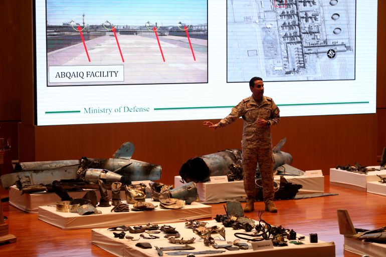 Saudi defence ministry spokesman Colonel Turki Al-Malik displays remains of the missiles which Saudi government says were used to attack an Aramco oil facility, during a news conference in Riyadh