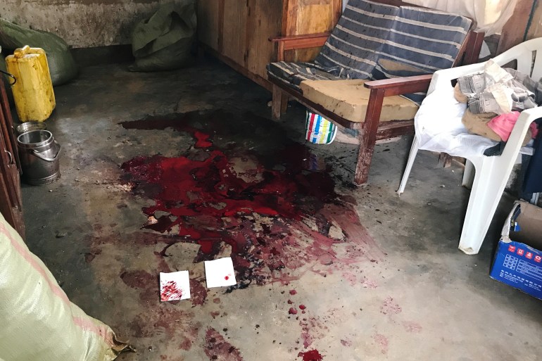 Blood stain is seen inside a house of the Pygmy ethnic group after an overnight attack in Mbau village near Beni