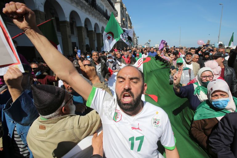 A demonstrator gestures during a protest demanding political change, in Algiers