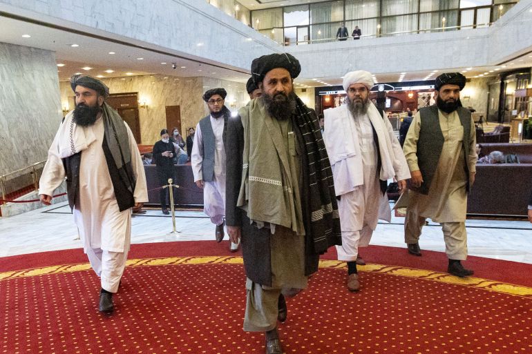 Mullah Abdul Ghani Baradar, the Taliban's deputy leader and negotiator, and other delegation members attend the Afghan peace conference in Moscow, Russia March 18, 2021. Alexander Zemlianichenko/Pool via REUTERS