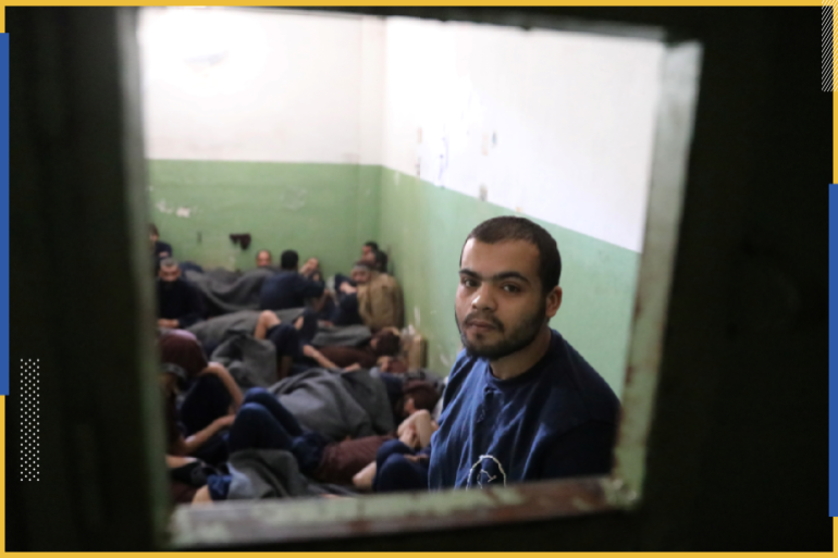 A prisoner, suspected of being part of the Islamic State, looks out from a prison cell in Hasaka, Syria, January 7, 2020. Picture taken January 7, 2020. REUTERS/Goran Tomasevic