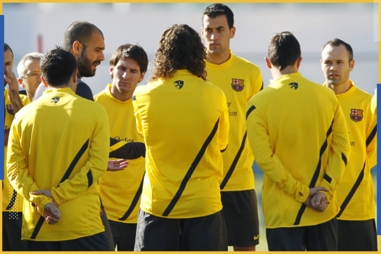 Barcelona's coach Pep Guardiola (4th L) speaks to his players Javier Mascherano (L), Xavi (3rd L), Lionel Messi (5th L), Carles Puyol (C), Sergio Busquets (3rd R), David Villa (2nd R) and Andres Iniesta during a practice session for their upcoming Club World Cup soccer match against Qatar's Al Sadd in Yokohama, south of Tokyo December 12, 2011. REUTERS/Toru Hanai (JAPAN - Tags: SPORT SOCCER)