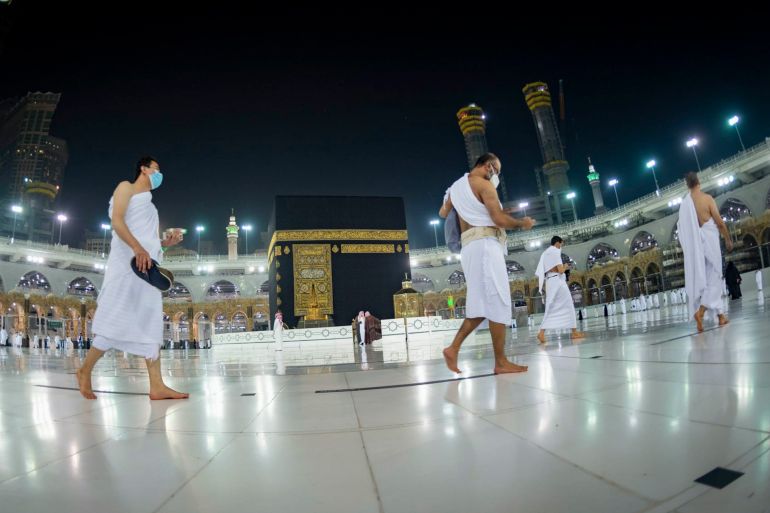 A handout picture provided by the Saudi Ministry of Hajj and Umrah on October 4, 2020, shows Saudis and foreign residents circumambulating the Kaaba (Tawaf) in the Grand Mosque complex in the holy city of Mecca, as authorities partially resume the year-round Umrah for a limited number of pilgrims amid extensive health precautions after a seven-month coronavirus hiatus. (Photo by - / Saudi Ministry of Hajj and Umra / AFP) (Photo by -/Saudi Ministry of Hajj and Umra/AFP via Getty Images)