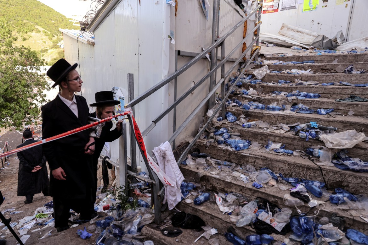 Orthodox Jews inspect a stairway that witnessed the deadly stampede during their religious celebration (Reuters)