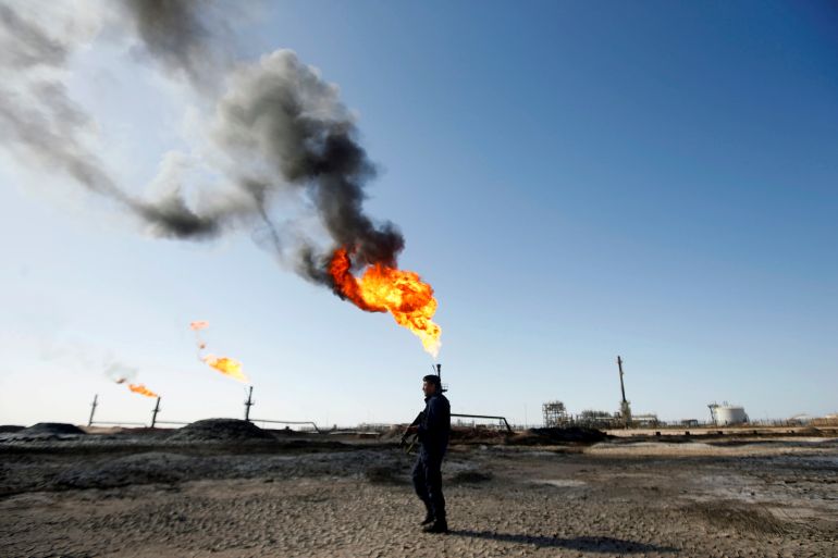 A policeman is seen at West Qurna-1 oil field, which is operated by ExxonMobil, in Basra
