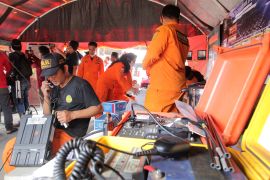 Indonesian Search an Rescue Agency personnel prepare for search and rescue for victims of a ship collision at a port