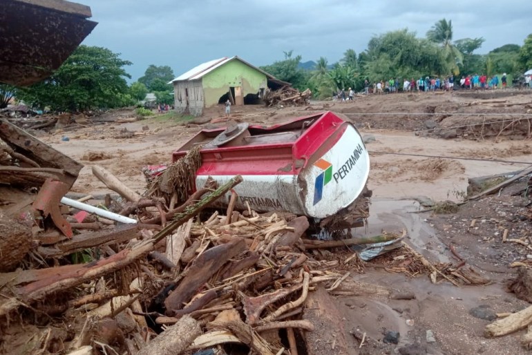 A damaged truck is seen at an area affected by flash floods after heavy rains in East Flores, East Nusa Tenggara province, Indonesia April 4, 2021, in this photo distributed by Antara Foto