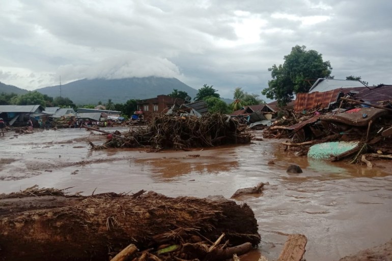 Damaged houses are seen at an area affected by flash floods after heavy rains in East Flores, East Nusa Tenggara province, Indonesia April 4, 2021 in this photo distributed by Antara Foto