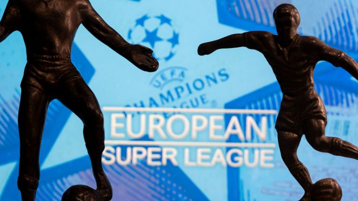 Metal figures of football players are seen in front of the words "European Super League" and the UEFA Champions League logo in this illustration Metal figures of football players are seen in front of the words "European Super League" and the UEFA Champions League logo in this illustration taken April 20, 2021. REUTERS/Dado Ruvic/Illustration
