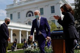 U.S. Attorney General Merrick Garland watches as Vice President Kamala Harris applauds President Joe Biden after Biden announced his administration's first steps to curb gun violence in the Rose Garden at the White House in Washington, U.S., April 8, 2021. REUTERS/Kevin Lamarque