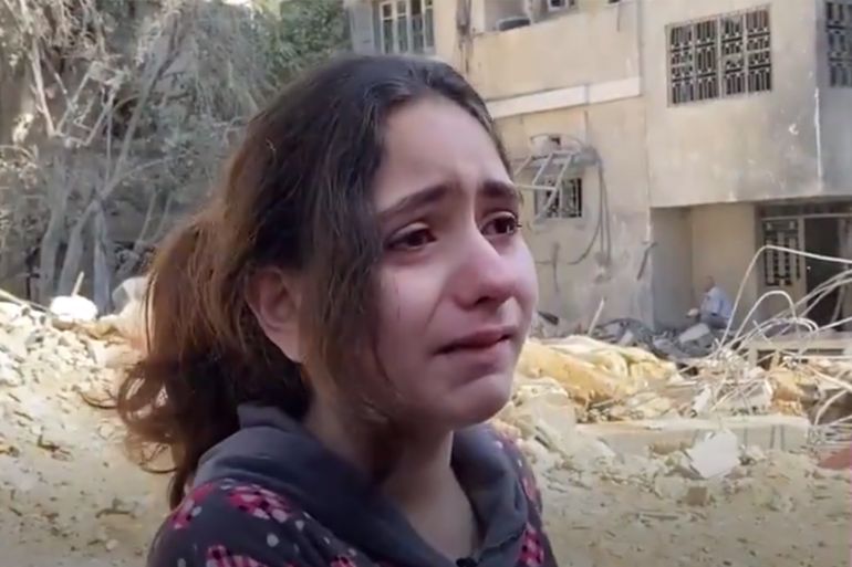 A 10-year-old Palestinian girl breaks down while talking to MEE after Israeli air strikes destroyed her neighbour's house, killing 8 children and 2 women