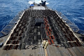 Thousands of illicit weapons are displayed onboard the guided-missile cruiser USS Monterey (CG 61) which was seized from a stateless dhow in international waters of the North Arabian Sea
