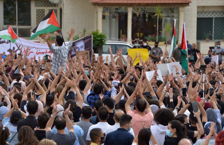Jordanians demonstrate to express solidarity with the Palestinian people, near the Israeli embassy in Amman