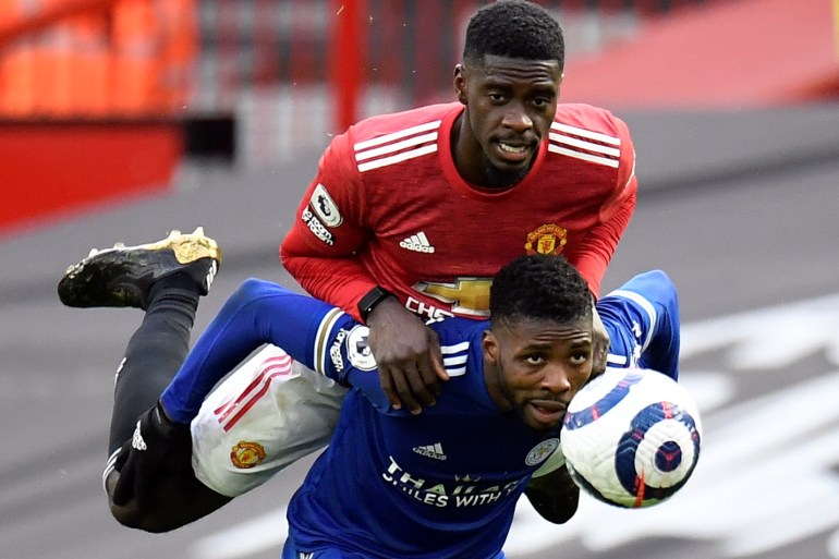 Premier League - Manchester United v Leicester City Soccer Football - Premier League - Manchester United v Leicester City - Old Trafford, Manchester, Britain - May 11, 2021 Manchester United's Axel Tuanzebe in action with Leicester City's Kelechi Iheanacho Pool via REUTERS/Peter Powell EDITORIAL USE ONLY. No use with unauthorized audio, video, data, fixture lists, club/league logos or 'live' services. Online in-match use limited to 75 images, no video emulation. No use in betting, games or single club /league/player publications. Please contact your account representative for further details. TPX IMAGES OF THE DAY