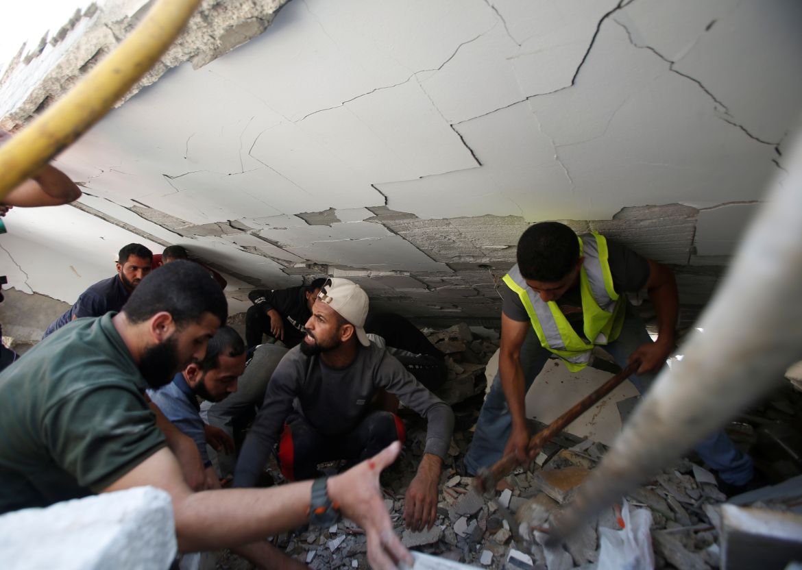 Rescue search for victims at the site of Israeli air strikes, in Gaza City