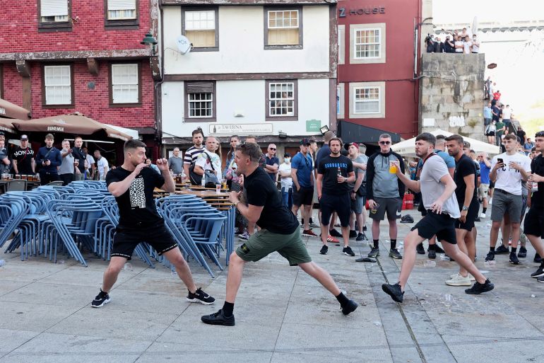Manchester City supporters clash with police at Ribeira in Porto on May 28, 2021 on the eve of UEFA Champions League final football match between Manchester United and Chelsea at the Dragao stadium