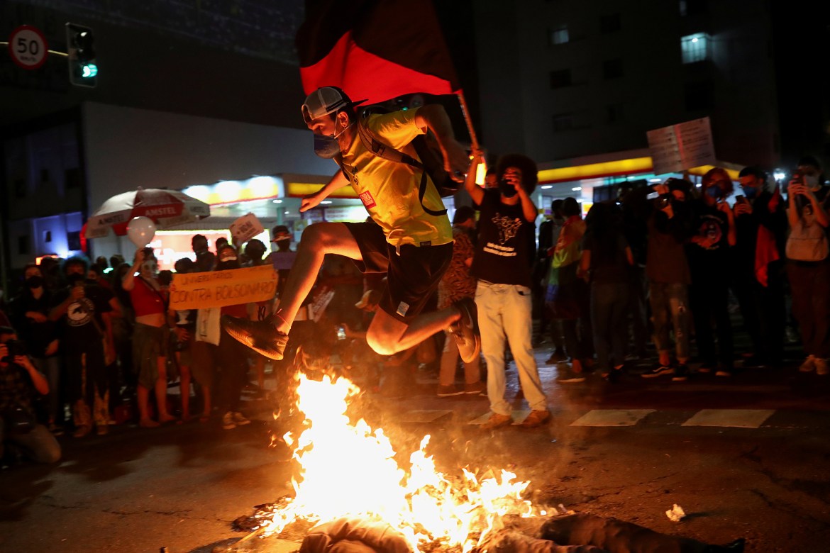 Protesters burn an effigy of Bolsonaro during a protest against him, in front of the Museum of Modern Art in São Paulo (Reuters)
