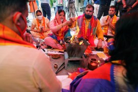 Hindu priests and supporters of the Vishva Hindu Parishad (VHP), a Hindu nationalist organisation, perform "havan" (traditional Hindu fire ritual) as part of a special prayer for a stone laying ceremony of the Ram Temple in Ayodhya