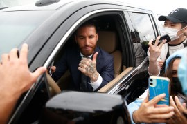 Real Madrid captain Sergio Ramos leaves the club after 16 years Soccer Football - Real Madrid captain Sergio Ramos leaves the club after 16 years - Ciudad Real Madrid, Valdebebas, Madrid, Spain - June 17, 2021 Real Madrid fans with Real Madrid's Sergio Ramos outside Ciudad Real Madrid, Valdebebas REUTERS/Susana Vera