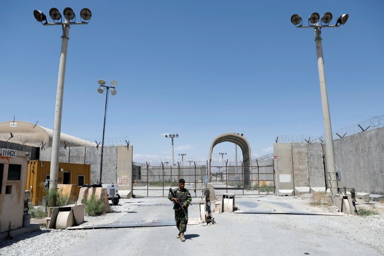 Afghan National Army soldier stands guard at Bagram U.S. air base gate