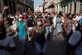 People shout slogans against the government during a protest in Havana