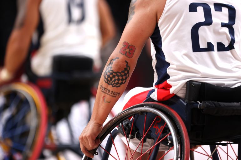 2020 Tokyo Paralympics - Day 2 TOKYO, JAPAN - AUGUST 26: A detailed view of a Tokyo 2020 Paralympic logo tattoo onto the arm of Jhoan Vargas of Team Colombia during the Wheelchair Basketball Men's preliminary round group A match between team Colombia and team Japan at Musashino Forest Sports Plaza on day 2 of the Tokyo 2020 Paralympic Games at on August 26, 2021 in Chofu, Tokyo, Japan. (Photo by Alex Pantling/Getty Images)