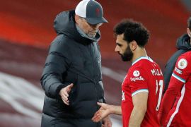 Premier League - Liverpool v Southampton Soccer Football - Premier League - Liverpool v Southampton - Anfield, Liverpool, Britain - May 8, 2021 Liverpool's Mohamed Salah with manager Juergen Klopp as he walks off Pool via REUTERS/Phil Noble EDITORIAL USE ONLY. No use with unauthorized audio, video, data, fixture lists, club/league logos or 'live' services. Online in-match use limited to 75 images, no video emulation. No use in betting, games or single club /league/player publications. Please contact your account representative for further details.