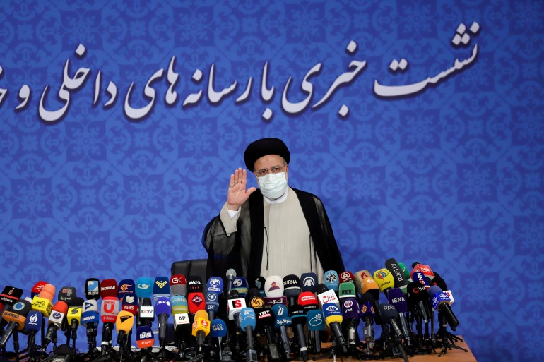 Iran's President-elect Ebrahim Raisi gestures at a news conference in Tehran