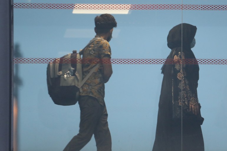 People evacuated from Afghanistan arrive at Roissy Charles-de-Gaulle airport, near Paris