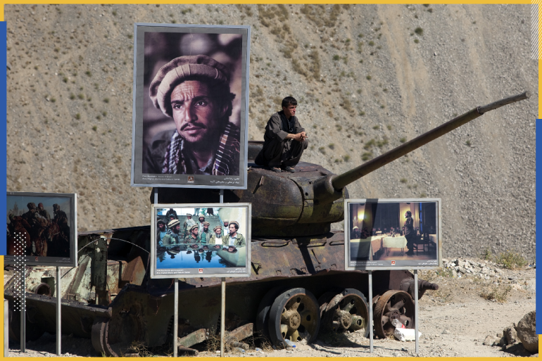 PANJSHIR, AFGHANISTAN -SEPTEMBER 10: An Afghan sits on top of a tank paying his respects, as he is surround by photos of Ahmed Shah Massoud September 10, 2009 in Panjshir, Afghanistan. Top challenger Abdullah Abdullah was joined thousands who came to honor the Afghan national hero Ahmed Shah Massoud at his mausoleum marking the eighth anniversary of his death. (Photo by Paula Bronstein/Getty Images)