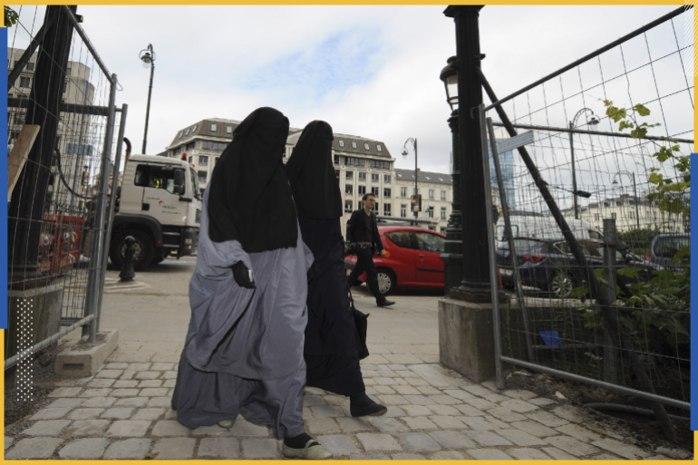 Imen (L) and Halima (R), wearing a niqab, walk on the street before French businessman Rachid Nekkaz (not seen), who is said to be a candidate for the 2012 France's presidential election, made an announcement in Brussels August 17, 2011. Nekkaz is prepared to pay the fines that women may receive for wearing the burqa or niqab on the street and was putting a property worth around one million euros up for sale to fund his campaign, local media reported. France and Belgium banned full face veils, making anyone wearing the Muslim niqab or burqa in public liable to a fine. REUTERS/Laurent Dubrule (BELGIUM - Tags: RELIGION POLITICS)
