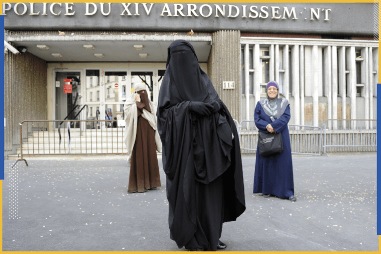 Nayet (C), wearing a Burqa, and Kenza Drider (L), a French Muslim of North African descent, wearing a niqab, are seen after their release from a police station in Paris April 11, 2011. France's ban on full face veils, a first in Europe, went into force today, exposing anyone who wears the Muslim niqab or burqa in public to fines of 150 euros ($216) and lessons in French citizenship. REUTERS/Gonzalo Fuentes (FRANCE - Tags: POLITICS RELIGION CRIME LAW)