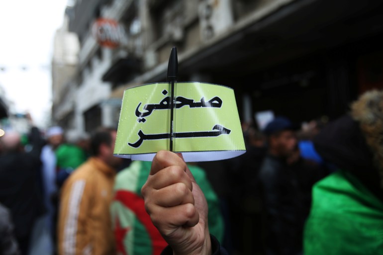Algerian journalists demonstrate for freedom of the press during a protest against the country's ruling elite and rejecting the December presidential election in Algiers Algerian journalists demonstrate for freedom of the press during a protest against the country's ruling elite and rejecting the December presidential election in Algiers, Algeria November 15, 2019. The armband reads "Free journalist." REUTERS/Ramzi Boudina