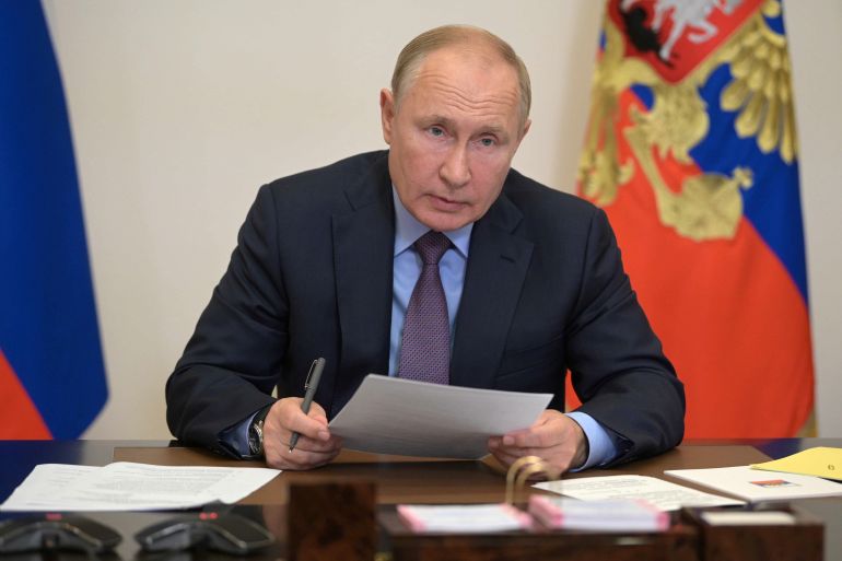 Russian President Vladimir Putin attends a meeting via a video link in Moscow