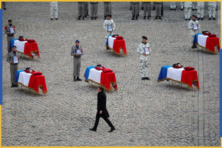 French President Emmanuel Macron walks past the flag-draped coffins of the thirteen French soldiers killed in Mali, during a ceremony at the Hotel National des Invalides in Paris, France, December 2, 2019. French soldiers Julien Carrette, Benjamin Gireud, Romain Salles de Saint-Paul, Clement Frison-Roche, Nicolas Megard, Romain Chomel de Jarnieu, Pierre Bockel, Alex Morisse, Jeremy Leusie, Alexandre Protin, Antoine Serre, Valentin Duval, Andrei Jouk died in Mali when their helicopters collided in the dark last week as they hunted for Islamist militants. REUTERS/Charles Platiau